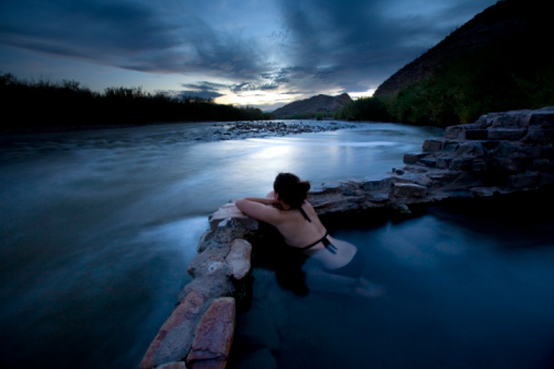 "A woman enjoys the hot springs in Big Bend National Park, Texas." Ian Shive, Aurora. 28 Jul 2013.