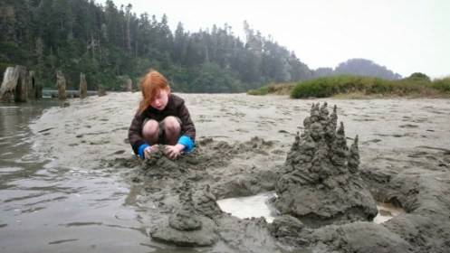"Young girl making sandcastles on foggy beach." Daniel MacDonald, Flickr. 2013.